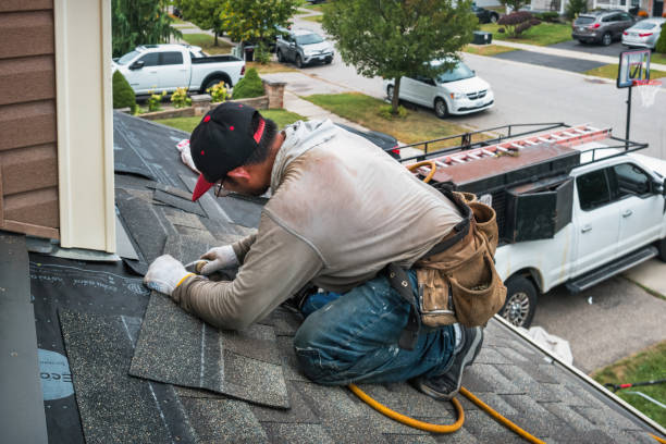 Professional Roofing technician working in Marion, NY